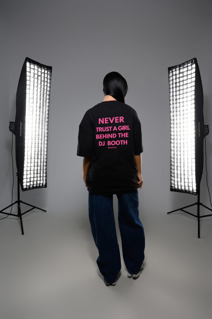 Never trust a girl behind the DJ boooth loose tee (pink letters)