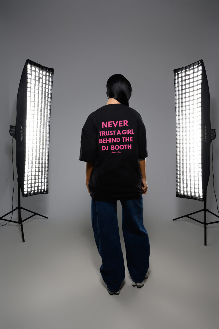 Never trust a girl behind the DJ boooth loose tee (pink letters)