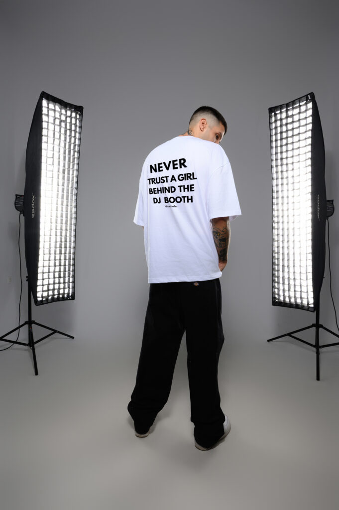 Never trust a girl behind the DJ booth loose tee